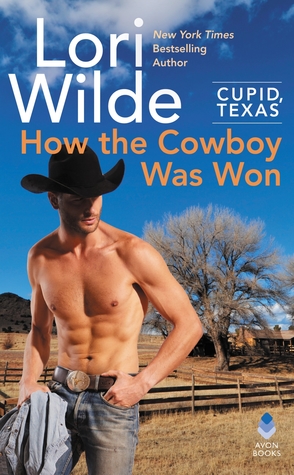 Ripped guy in a cowboy hat on a desert plain